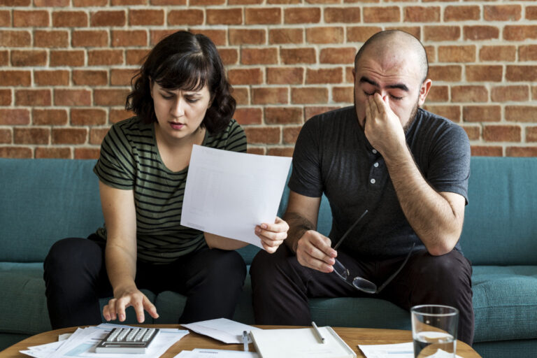 Selling property under duress: debt or divorce